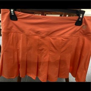 Orange Ele Ven medium tennis skirt